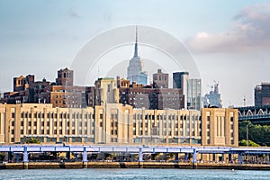 The view of Manhattan skyline and Brookyn bridge from Brooklyn side after sunrise , New york city