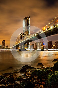 View of Manhattan skyline and Brookyn bridge from Brooklyn side after sunset , New york city