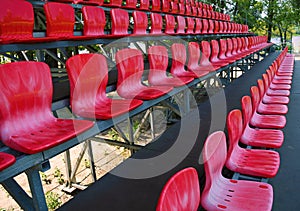 View of the many red seats in the football stadium. Sports