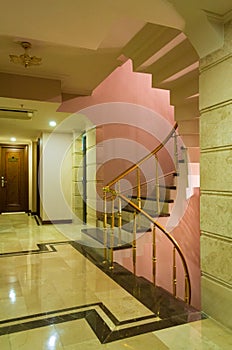View of a marble shiny hotell hall and spiral staircase