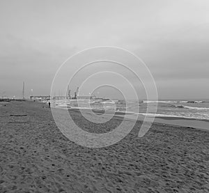 view of Marina di Carrara harbour from Marinella in tuscany