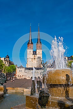 View of Market Church of Our Dear Lady or Marktkirche Unser Lieben Frauen and Gobel Fountain in Halle (Saale), Germany