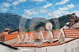 View of Marmaris from above, the roofs of houses from the tiles and the mountains. Turkey