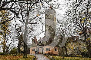 View on medieval castle gate from park Burggarten in old town Rothenburg ob der Tauber, Bavaria, Germany. November 2014