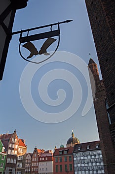 View of medieval Gdansk old city center buildings with guild sign