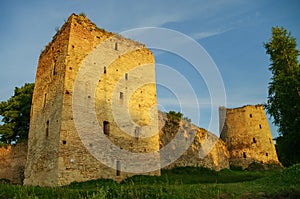 A view of the medieval Izborsk fortress walls and towers in suns
