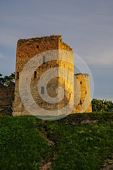 A view of the medieval Izborsk fortress walls and towers in suns