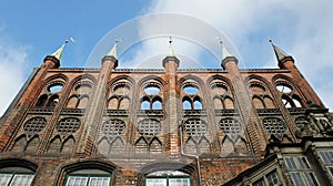 View of the medieval old town hall or Lubecker Rathaus, blue sky, beautiful architecture, Lubeck, Germany