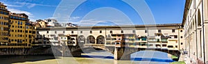 View of medieval stone bridge Ponte Vecchio and the Arno River from the Ponte Santa Trinita Holy Trinity Bridge in Florence, Tus