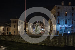 View on medieval town square with Christmas decorations, Vittorio Veneto, Italy