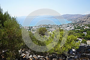 View of the Mediterranean coast in the vicinity of Pefki in August. Pefkos or Pefki, Rhodes Island, Greece photo