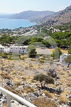 View of the Mediterranean coast in the vicinity of Pefki in August. Pefkos or Pefki, Rhodes Island, Greece photo