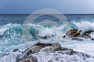 View of the Mediterranean Sea in summer time, while a huge storm erupted at sea, with splashing white waves that are five meters h