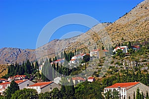 View of Mediterranean village on the hills in Greece