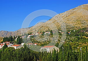 View of Mediterranean village on the hills in Greece