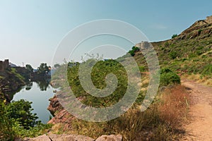 View of Mehrangarh fort from Rao Jodha desert rock park, Jodhpur, India. A lake in foreground and Mehrangarh fort in the