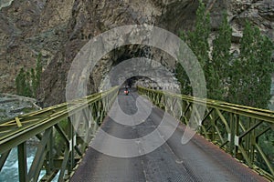 A view of a metal Truss bridge on the way to Nubra valley with rock-cut Himalaya mountain, Ladakh,