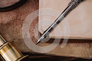 View of metallic nib on blank page of copy book