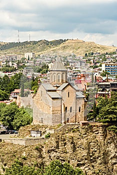 View of Metekhi, with parts of Tbilisi\'s Old Town seen on the horizon.