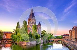 View of Metz with Temple Neuf reflected in the Moselle River, Lorraine, France.