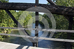 View of middle fork river through bridge beams