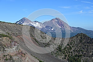 View of Middle and North Sisters volcanoes from Tam McArthur Rim Trail, Oregon.