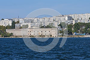 View of the Mikhailovsky ravelin in the bay of Sevastopol and the houses of the northern side of the city