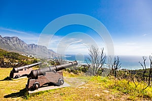 Military Cannons overlooking Camps Bay Beach on the Atlantic Seaboard of Cape Town photo