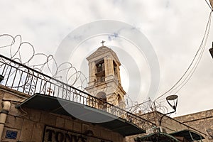 View from Milk Grotto Street to the bell tower of the Church of Nativity in Bethlehem in the Palestinian Authority, Israel
