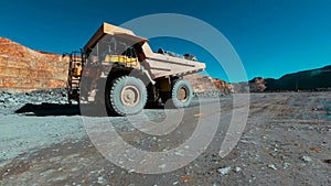 View of mining trucks transporting minerals to the leaching pads