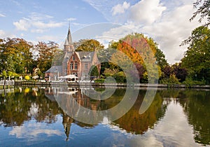 View of the Minnewater Lake & the gatehouse of a demolished castle in Bruges, Belgium