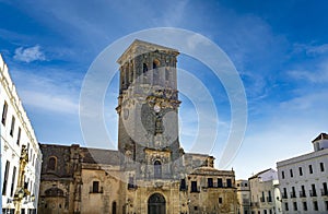 View of the minor basilica of Santa MarÃ­a de la AsunciÃ³n from the Cabildo square in Arcos de la Frontera photo