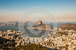 View from Mirante Dona Marta at sunset overlooking city of Rio de Janeiro and Guanabara Bay with Sugarloaf mountain in Brazil photo