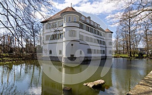 View of moated castle of Bad Rappenau at the beginning of spring with reflections in the castle moat