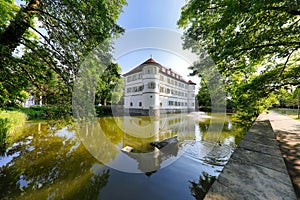 View of the Moated Castle surrounded with trees in the City of Bad Rappenau in Germany