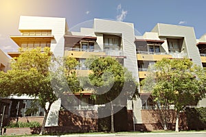 View of a Modern Apartment Building Exterior with Warm Lighting