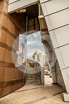 View on modern business office building and sky on the background. Urban exterior and tall perspective.