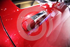 View of a modern car under a blue skay.