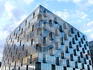 View of modern glass and metal building with many