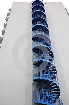 View of modern metal empty fire escape ladder near building outdoors
