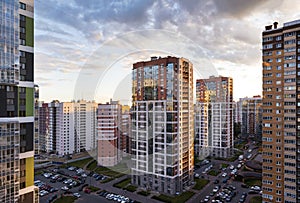 View of modern multistorey buildings in St. Petersburg at sunset against the sky