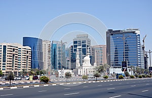 View of modern office buildings and a white coloured mosque across Baniyas Road in Deira Dubai