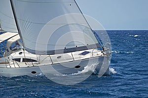 Modern sailing yacht in action photo