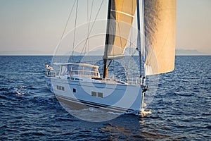 Modern sailing yacht in action photo