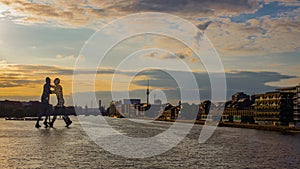 View on the Molecular men with TV tower at sunset in Berlin, Germany