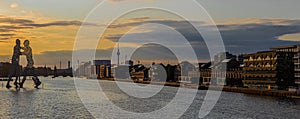 View on the Molecular men with TV tower at sunset in Berlin, Germany
