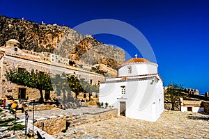 View on Monemvasia street panorama with old houses and Panagia Chrysafitissa church in ancient town, Peloponnese, Greece