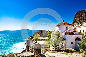 View on Monemvasia street panorama with old houses and Panagia Chrysafitissa church in ancient town, Peloponnese, Greece