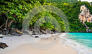 View of monkey beach at Ko Phi Phi islands, Thailand. Famous tropical beach with white sand and turquoise water. View from long