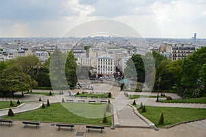View from Monmartre in Paris on a beautiful green park with walking trails